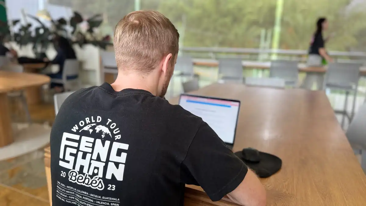 Matt working on a laptop in a coworking space